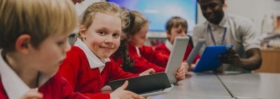 Young kids on laptops in classroom
