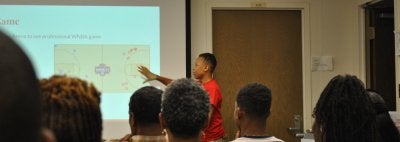 Student presenting on WNBA data for Mathletics